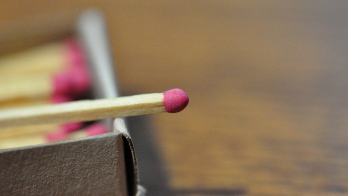 Pink tipped matchstick in a matchbox