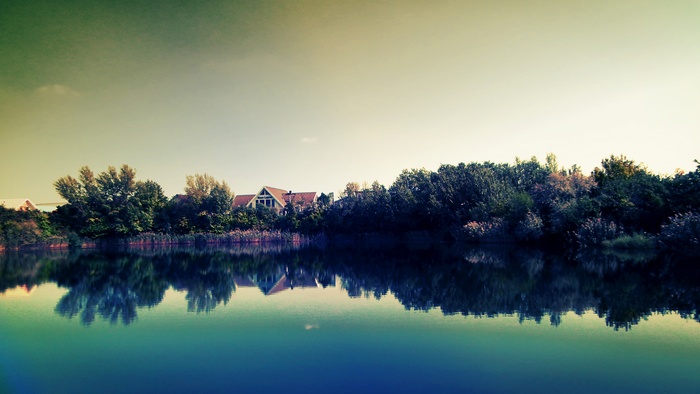 Lake resort with reflections and houses