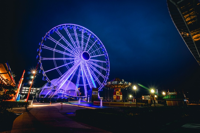 Ferris wheel and amusement park at night
