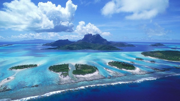 Bora Bora Island aerial view with mountains and turquoise water