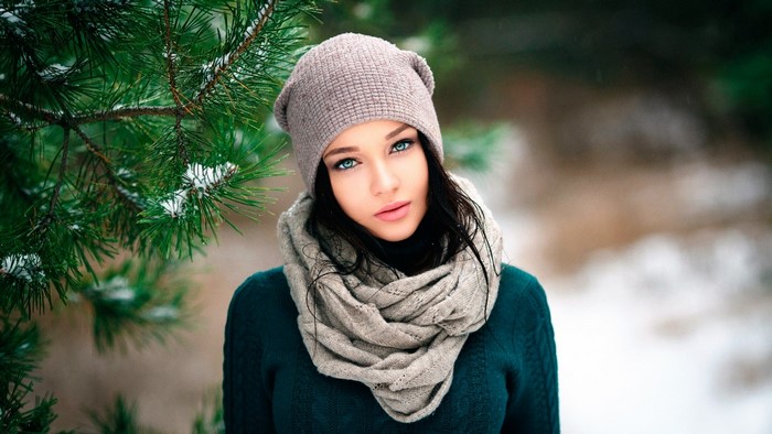 Girl in a forest with pine trees