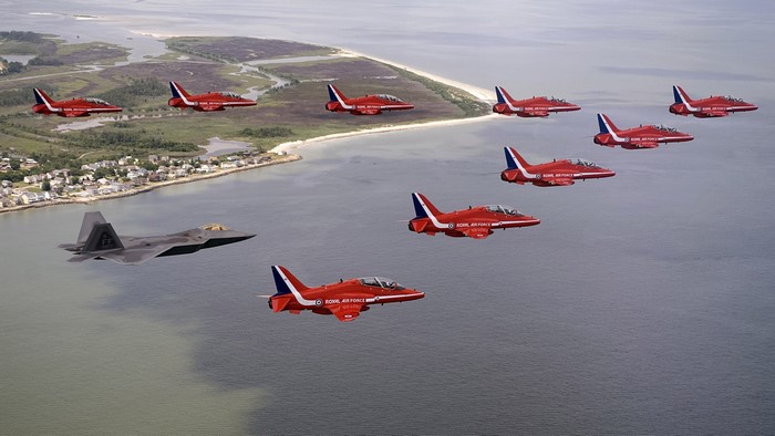 F-22 Raptor and Red Arrows formation flight