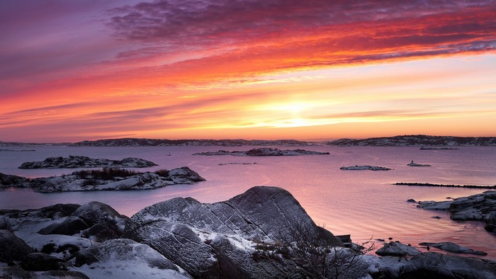 Sunset over a snowy archipelago