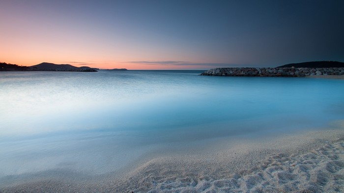 Beach at Dawn with Calm Water