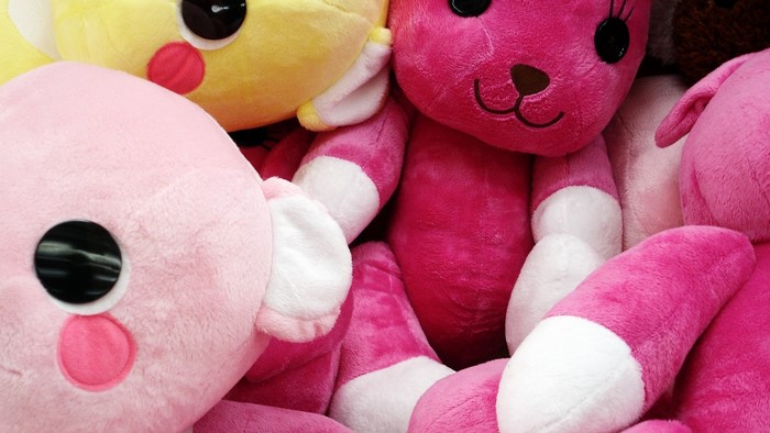 Pink and yellow teddy bears and bunnies