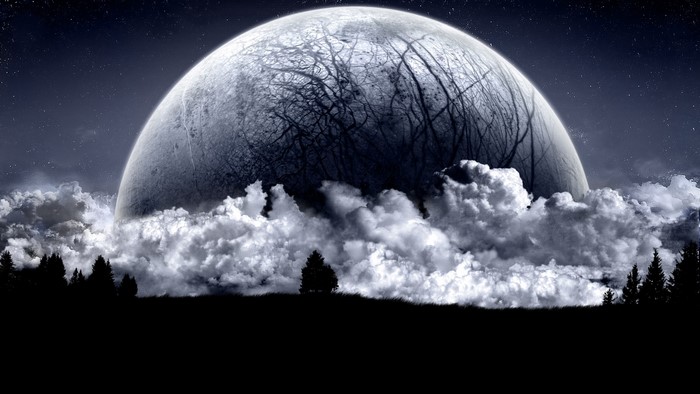Dark Moon Rising Over Clouds and Trees