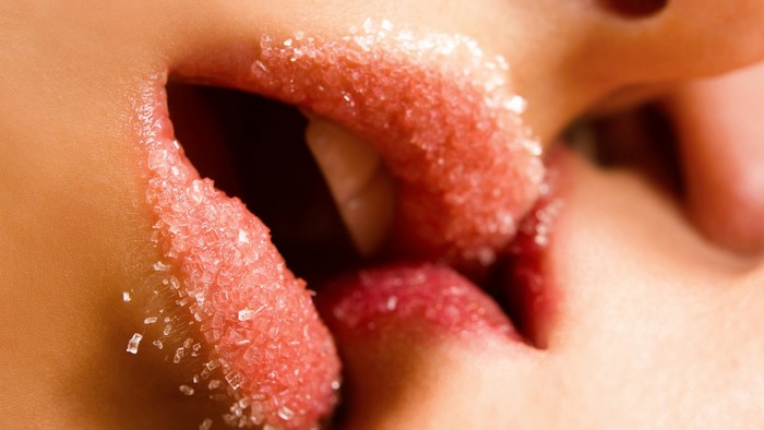 Close-up of lips with sugar