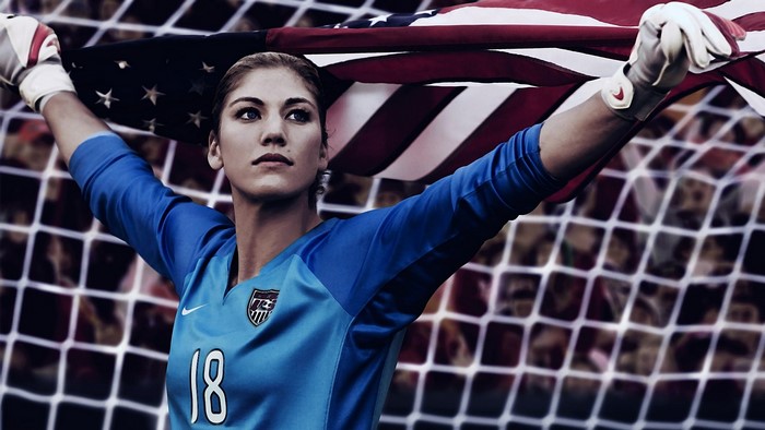 Hope Solo holding American flag
