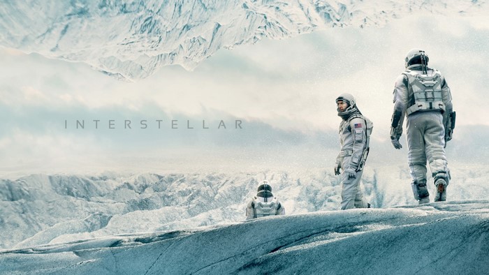 Interstellar movie poster with astronauts on icy planet