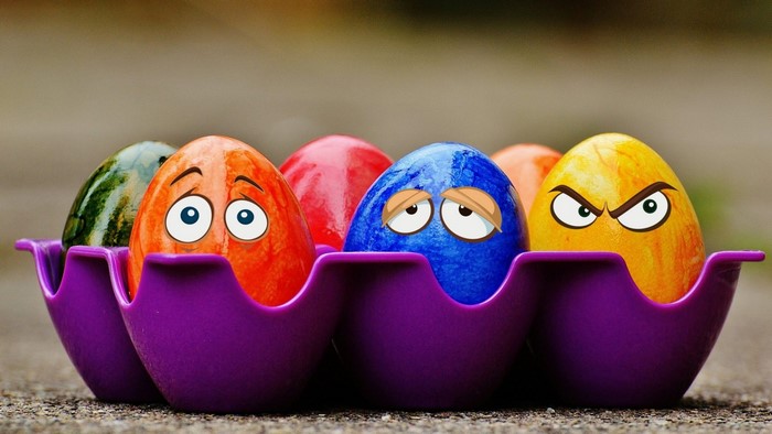 Funny Easter Eggs with Cartoon Faces in a Carton