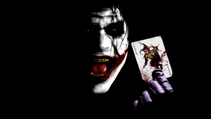 Joker holding a Joker card