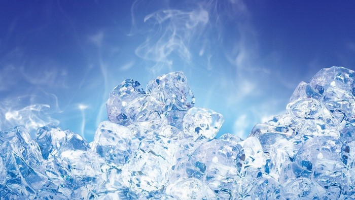 Pile of ice cubes with steam