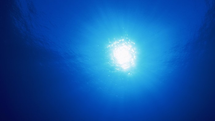 Sunlight seen through blue water