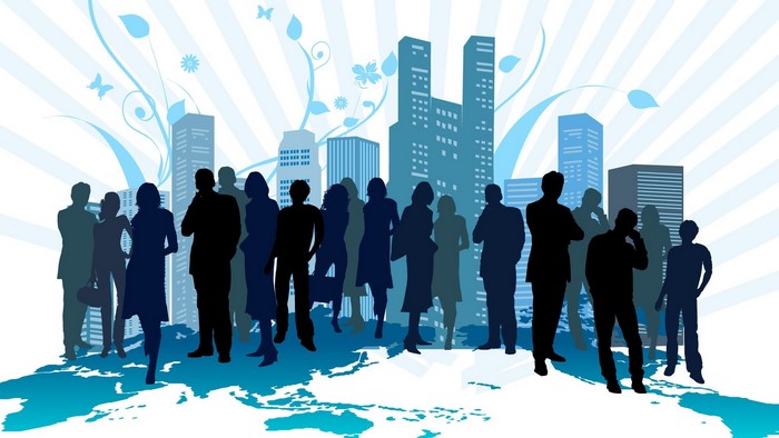Silhouettes of business people in front of city skyline