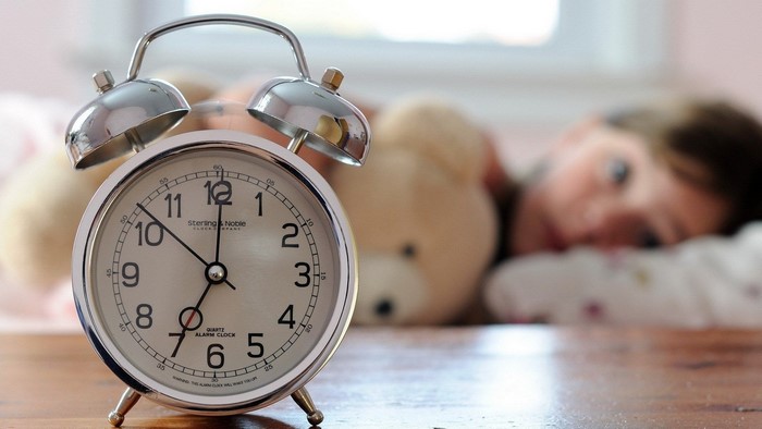 Sterling & Noble Alarm Clock with Child in Background