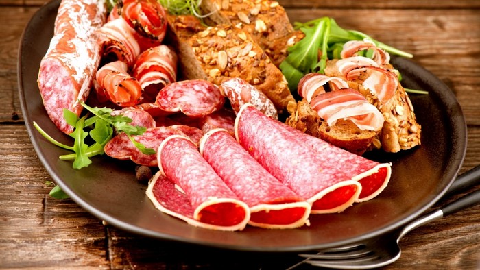 Charcuterie board with cured meats and bread