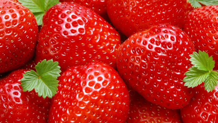 Fresh Red Strawberries with Green Leaves