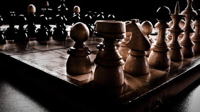 Wooden Chess Pieces on a Chessboard