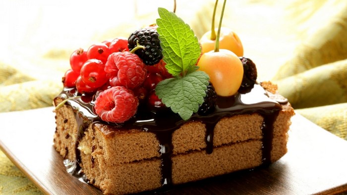 Chocolate cake with berries and chocolate glaze