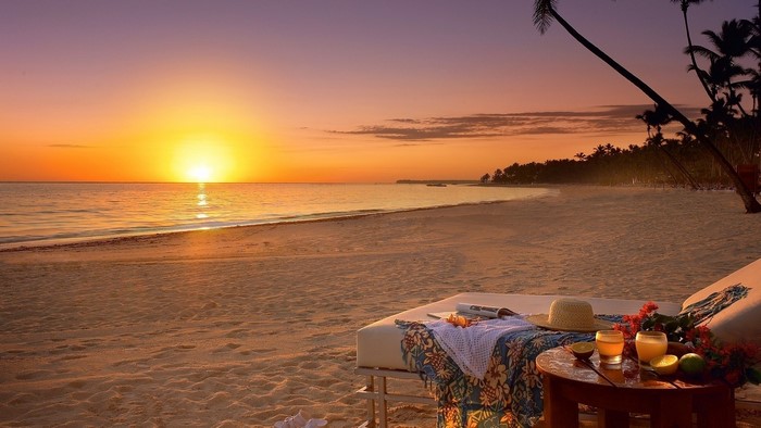 Tropical Beach Sunset with Lounge Chairs and Drinks