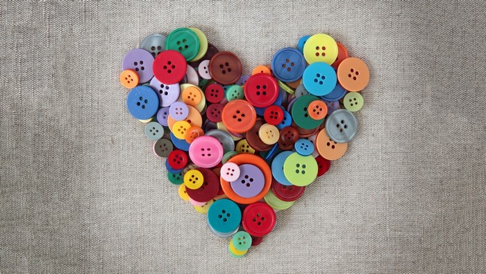 Heart shape made of colorful buttons