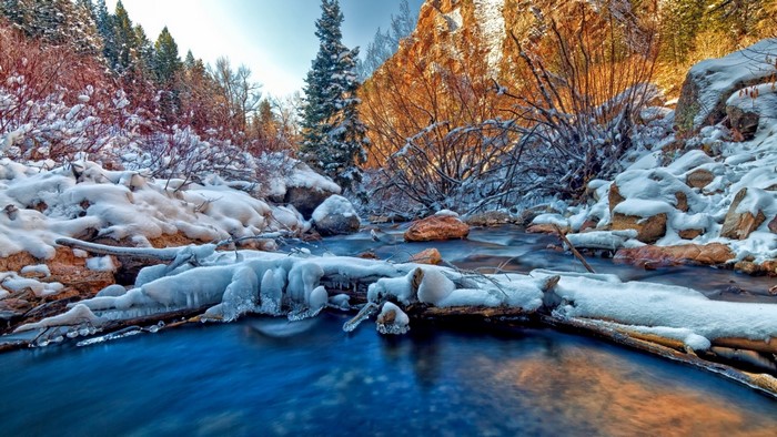 Frozen River in a Snowy Winter Landscape