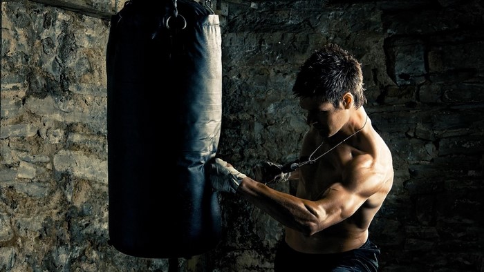 Man training with boxing bag