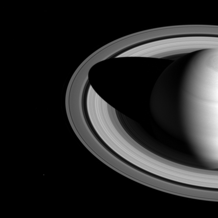 Saturn and its rings casting a shadow