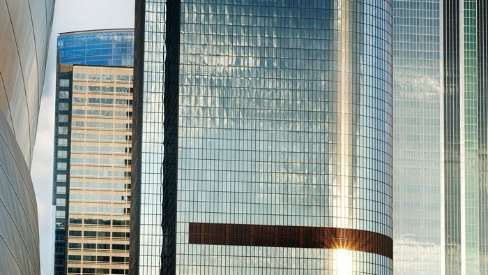 Modern skyscrapers with glass facades reflecting sunlight