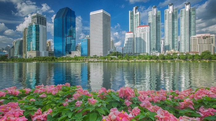 Bangkok Thailand cityscape with lake and flowers