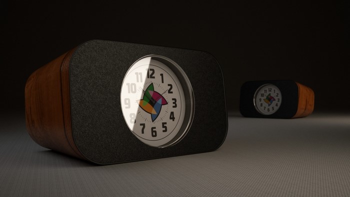 Two retro alarm clocks with wood and fabric