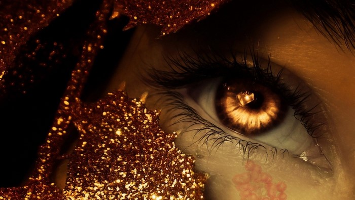 Close-up of a fantasy brown eye with glitter