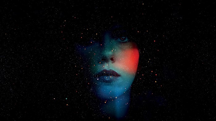 Woman's face superimposed on a starry background