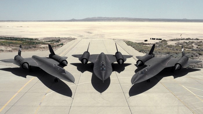 Three Lockheed SR-71 Blackbird planes on a runway