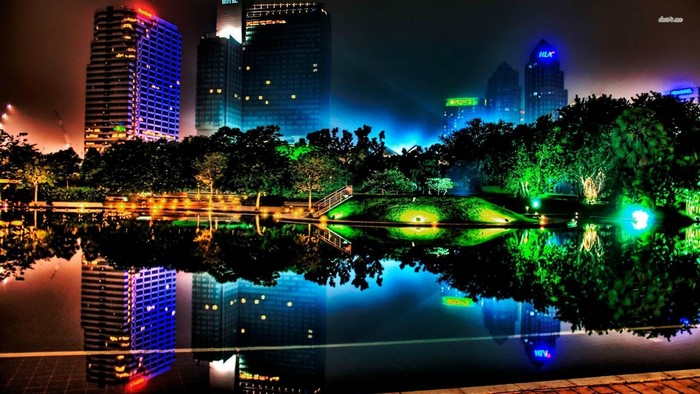 Colorful Cityscape at Night Reflected in Water