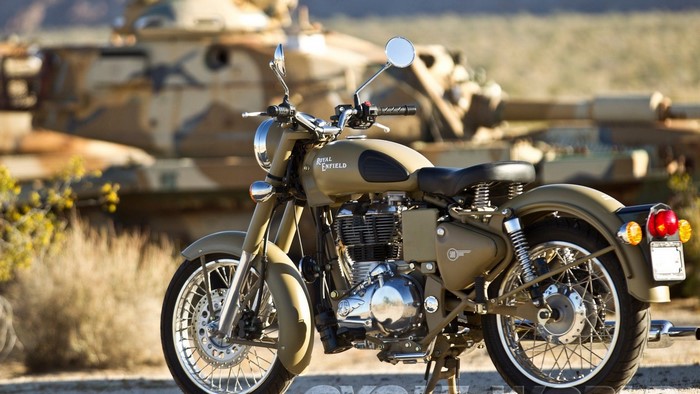 Royal Enfield Classic 500 motorcycle with tank in background