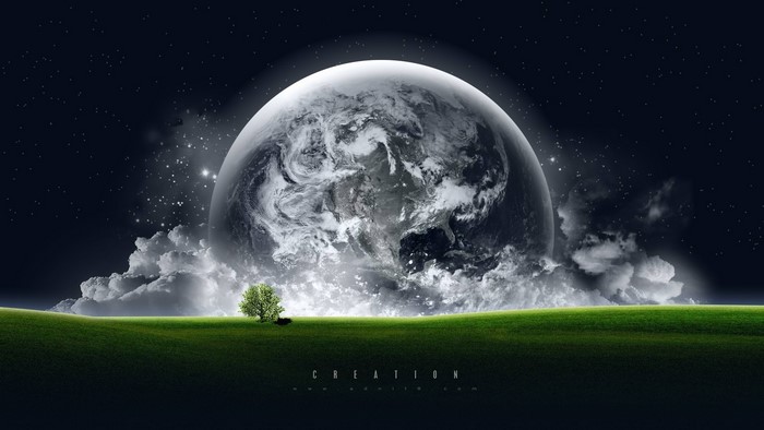 Earth rising over a grassy field with a lone tree