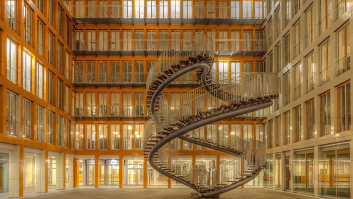 Spiral staircase in a modern building courtyard