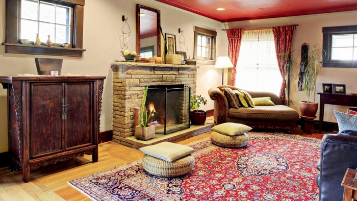 Living room with fireplace and oriental rug