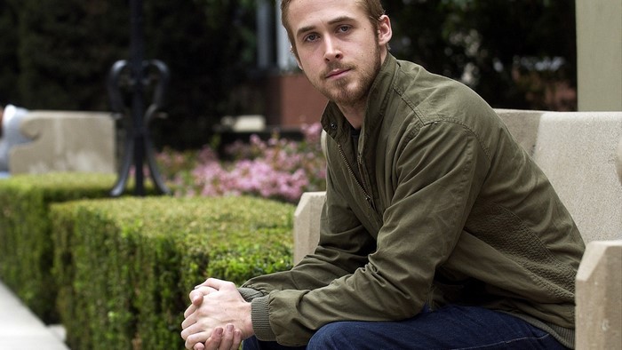 Ryan Gosling sitting on a bench
