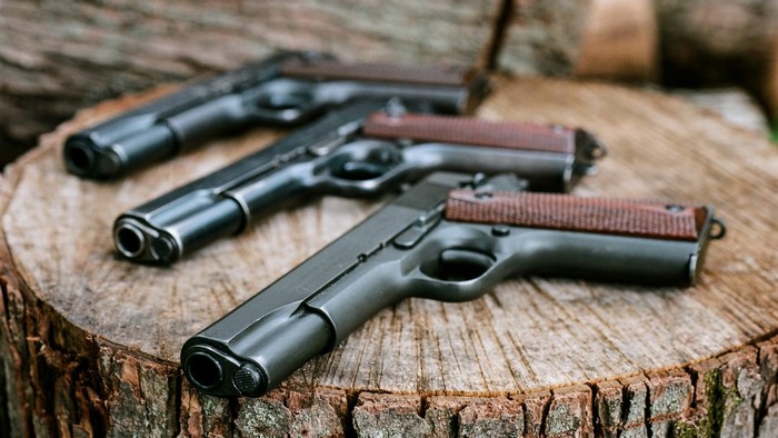 Colt M1911 Pistols on Wood