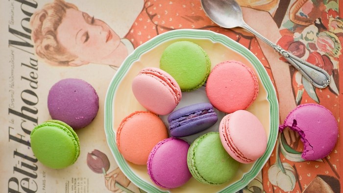 Colorful Macarons on a Plate with Vintage Illustration