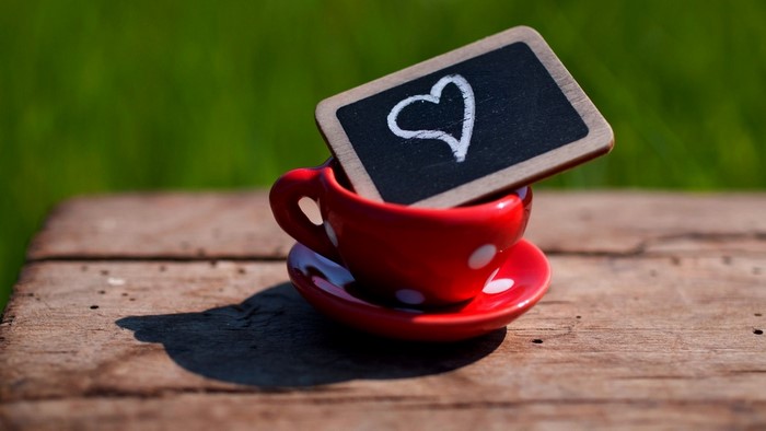 Red polka dot cup with heart drawing