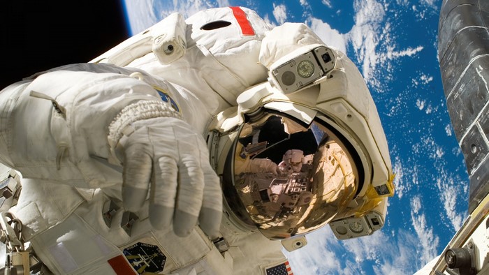 Astronaut in space with Earth below