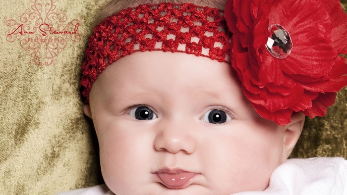 Baby with Red Headband and Flower