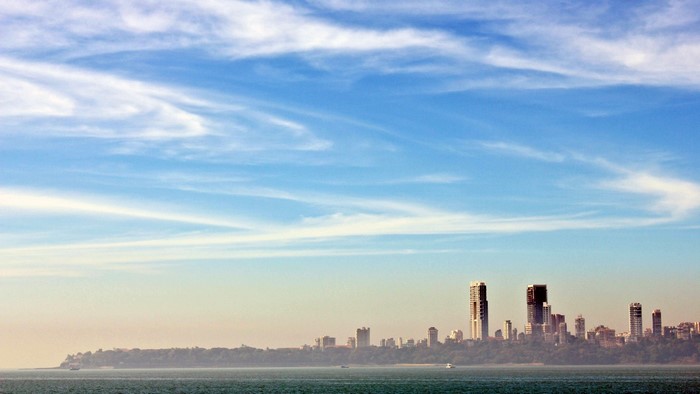Mumbai skyline with clouds and ocean