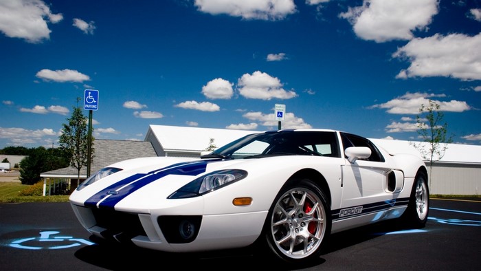 White Ford GT with Blue Stripes in Parking Lot