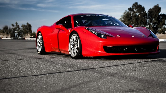 Red Ferrari 458 Italia on a Race Track