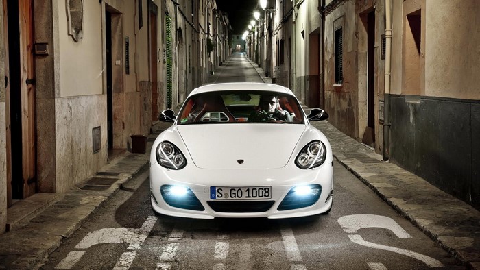 White Porsche Cayman S in Narrow Street at Night