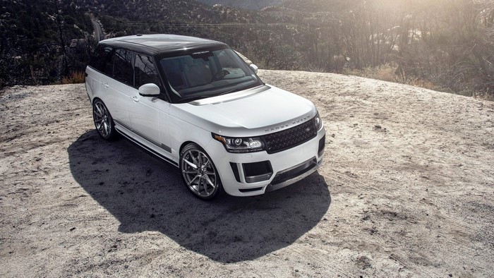 White Range Rover on a dirt road